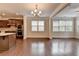 Bright dining area with hardwood floors, a chandelier, and large windows at 4395 Wildbrooke Pkwy, Cumming, GA 30041