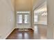 Elegant foyer featuring a high ceiling, hardwood floors, and a direct view into the dining area at 4395 Wildbrooke Pkwy, Cumming, GA 30041