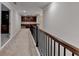 Upstairs hallway features dark wood railing and built-in cabinets at 4395 Wildbrooke Pkwy, Cumming, GA 30041