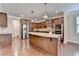 Elegant kitchen featuring stainless steel appliances, a large island, and warm wood cabinetry at 4395 Wildbrooke Pkwy, Cumming, GA 30041