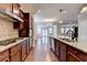 Spacious kitchen with stainless steel appliances, granite countertops, and access to the outdoor area at 4395 Wildbrooke Pkwy, Cumming, GA 30041