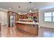 Spacious kitchen featuring a large island with granite countertop and stainless steel appliances at 4395 Wildbrooke Pkwy, Cumming, GA 30041