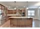 Spacious kitchen with stainless steel appliances and a large center island with granite countertop at 4395 Wildbrooke Pkwy, Cumming, GA 30041