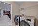 Well-equipped laundry area with modern washer and dryer, perfect for convenient chores at 4395 Wildbrooke Pkwy, Cumming, GA 30041