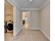 Bright laundry room featuring modern washer and dryer with tile flooring for easy maintenance at 4395 Wildbrooke Pkwy, Cumming, GA 30041