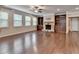 Living room featuring a stone fireplace and built-in bookshelves at 4395 Wildbrooke Pkwy, Cumming, GA 30041