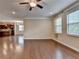 Bright living room with hardwood floors and access to the kitchen at 4395 Wildbrooke Pkwy, Cumming, GA 30041