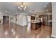 Open living room with kitchen and hardwood floors at 4395 Wildbrooke Pkwy, Cumming, GA 30041