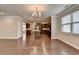 Open concept living room with hardwood floors and abundant natural light at 4395 Wildbrooke Pkwy, Cumming, GA 30041