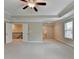 Spacious main bedroom featuring a tray ceiling, carpet and ensuite bathroom at 4395 Wildbrooke Pkwy, Cumming, GA 30041
