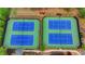 Aerial view of two community tennis courts with blue and green surfaces and well-maintained landscaping at 4395 Wildbrooke Pkwy, Cumming, GA 30041