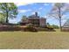 Spacious backyard with multiple decks, ideal for outdoor entertaining and enjoying the surroundings at 4631 Crooked Creek Ln, Villa Rica, GA 30180