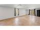 Unfinished basement area featuring tile flooring, a window, and double doors to the exterior at 4631 Crooked Creek Ln, Villa Rica, GA 30180