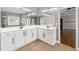 Beautiful primary bathroom vanity featuring white cabinets, double sinks, and modern fixtures at 4631 Crooked Creek Ln, Villa Rica, GA 30180