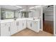 Bright bathroom with dual sinks, quartz countertops, and a large framed mirror at 4631 Crooked Creek Ln, Villa Rica, GA 30180