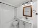Bathroom featuring a tub/shower combination, vanity, and neutral paint at 4631 Crooked Creek Ln, Villa Rica, GA 30180