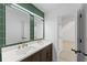 Bathroom with a dual sink vanity, a white countertop, and gold fixtures at 4631 Crooked Creek Ln, Villa Rica, GA 30180