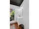 Charming powder room boasts natural light, wainscoting, vanity, and a rectangular mirror at 4631 Crooked Creek Ln, Villa Rica, GA 30180