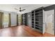 Bedroom featuring hardwood floors, windows, and bookshelves at 4631 Crooked Creek Ln, Villa Rica, GA 30180