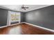 Bedroom with hardwood floors, neutral paint, and natural light from the window at 4631 Crooked Creek Ln, Villa Rica, GA 30180