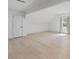 Bright bedroom with neutral paint, light wood floors, and a door at 4631 Crooked Creek Ln, Villa Rica, GA 30180