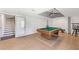 Game room with pool table, ceiling fan, and adjacent staircase at 4631 Crooked Creek Ln, Villa Rica, GA 30180