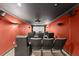 Home theater room with black ceiling, red walls and movie screen at 4631 Crooked Creek Ln, Villa Rica, GA 30180