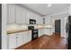 Modern kitchen boasts white cabinets, wood countertops, and stainless appliances at 4631 Crooked Creek Ln, Villa Rica, GA 30180