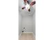 Small laundry room with a ceiling fan and tile floors at 4631 Crooked Creek Ln, Villa Rica, GA 30180