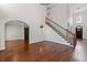 Spacious living room with hardwood floors, grand staircase, and ample natural light at 4631 Crooked Creek Ln, Villa Rica, GA 30180