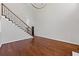 Bright, open living room with hardwood floors, high ceilings, and elegant staircase at 4631 Crooked Creek Ln, Villa Rica, GA 30180