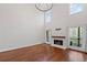 Spacious living room with fireplace, tall windows, and hardwood flooring at 4631 Crooked Creek Ln, Villa Rica, GA 30180
