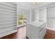 Spacious walk-in closet with custom built-in shelving and drawers and a window providing natural light at 4631 Crooked Creek Ln, Villa Rica, GA 30180