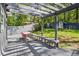 Inviting backyard deck with covered pergola, dining set, and built-in benches, perfect for outdoor living at 1211 Argonne Ne Way, Atlanta, GA 30324