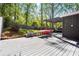 Outdoor deck with dining and lounging areas, perfect for entertaining in a private backyard setting at 1211 Argonne Ne Way, Atlanta, GA 30324