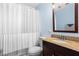 Stylish bathroom with granite countertop vanity, and shower and tub combo at 1211 Argonne Ne Way, Atlanta, GA 30324