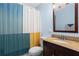 Well-lit bathroom with granite vanity and a modern colorful shower curtain at 1211 Argonne Ne Way, Atlanta, GA 30324