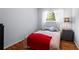 Comfortable bedroom with light gray walls, wood floor, and a window for natural lighting at 1211 Argonne Ne Way, Atlanta, GA 30324