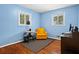 Bright bedroom with hardwood floors, two windows, and a modern work-from-home setup at 1211 Argonne Ne Way, Atlanta, GA 30324
