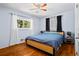 Comfortable bedroom featuring hardwood floors, ceiling fan, and plenty of natural light at 1211 Argonne Ne Way, Atlanta, GA 30324