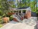 Beautiful home with brick accents, a front porch, and a spacious driveway leading to the entrance at 1211 Argonne Ne Way, Atlanta, GA 30324