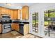 Efficient kitchen with stainless steel appliances and easy access to the outdoor patio through glass doors at 1211 Argonne Ne Way, Atlanta, GA 30324