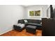 Comfortable living room featuring hardwood floors, a gray sectional sofa, and natural light at 1211 Argonne Ne Way, Atlanta, GA 30324