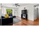 Well-lit living room with hardwood floors, modern furnishings, and access to the outdoors at 1211 Argonne Ne Way, Atlanta, GA 30324