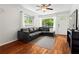 Bright living room with hardwood floors, a comfortable couch, and natural light at 1211 Argonne Ne Way, Atlanta, GA 30324