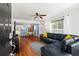 Cozy living room with hardwood floors, a ceiling fan, and an open view into the adjacent dining area at 1211 Argonne Ne Way, Atlanta, GA 30324