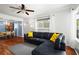 Inviting living room featuring hardwood floors, a ceiling fan, and natural light at 1211 Argonne Ne Way, Atlanta, GA 30324