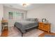Cozy bedroom with a large bed, hardwood floors, and soft, neutral tones at 1705 Monroe Ne Dr # D01, Atlanta, GA 30324