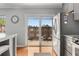 Bright kitchen with stainless steel refrigerator and sliding glass door to outdoor area at 1705 Monroe Ne Dr # D01, Atlanta, GA 30324