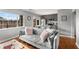 Stylish living room with hardwood floors, gray walls, and view of modern kitchen at 1705 Monroe Ne Dr # D01, Atlanta, GA 30324